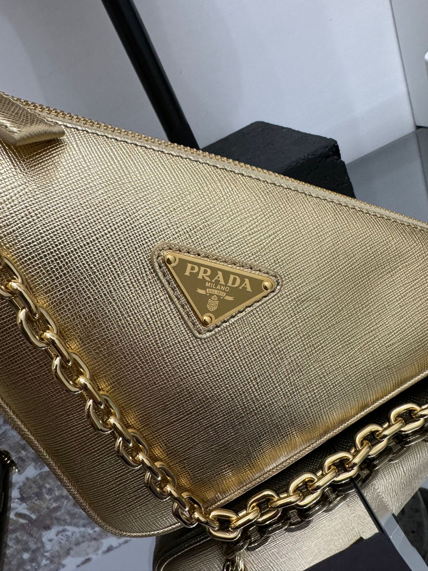 Gold leather triangle bag