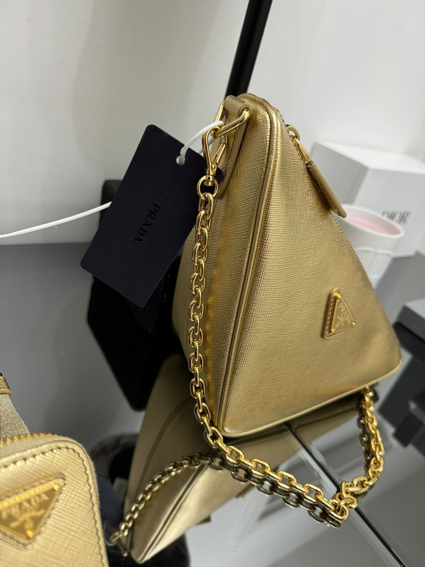 Gold leather triangle bag