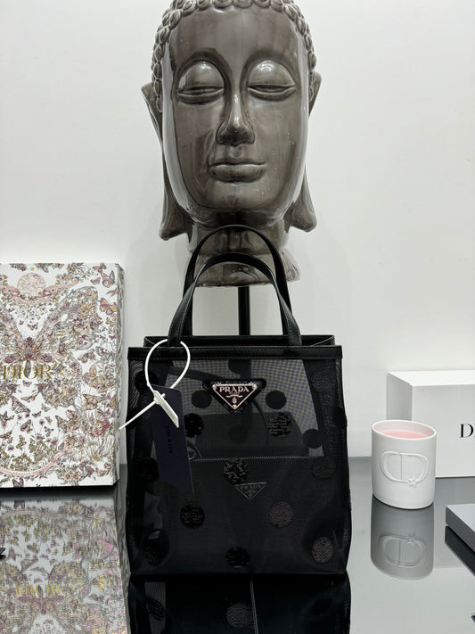 Small bag in mesh and leather with black sequins